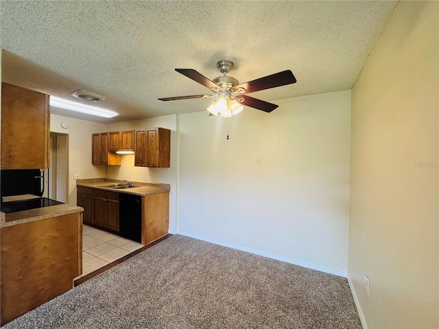 1695 Lee Rd Unit E214, Winter Park, FL 32789 - kitchen featuring dishwasher, a sink, light carpet, a ceiling fan, and a textured ceiling