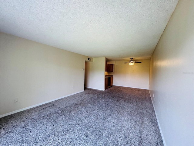 1695 Lee Rd Unit E214, Winter Park, FL 32789 - carpeted empty room featuring a ceiling fan, a textured ceiling, and baseboards