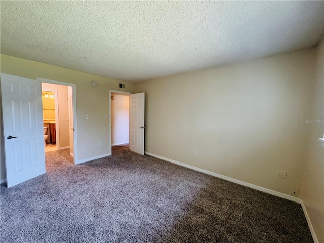 1695 Lee Rd Unit E214, Winter Park, FL 32789 - unfurnished bedroom with carpet floors, a textured ceiling, and baseboards