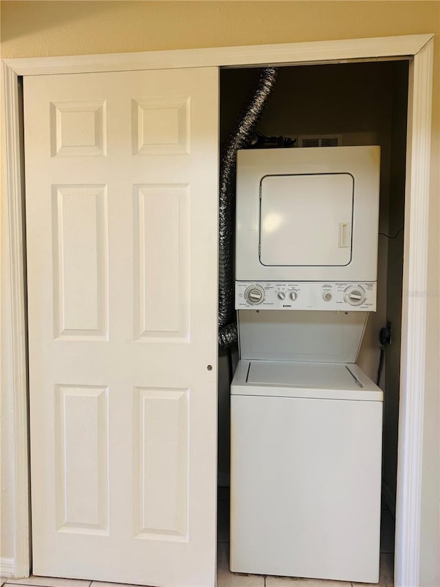 1695 Lee Rd Unit E214, Winter Park, FL 32789 - laundry room with stacked washer and clothes dryer