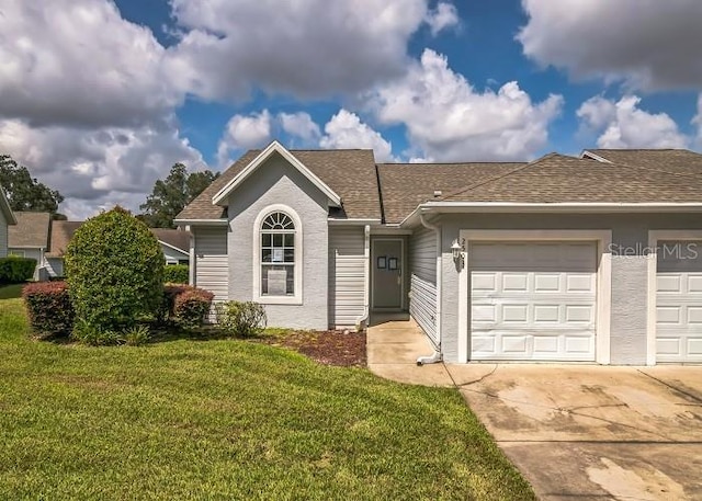 2503 SE 18th Cir, Ocala, FL 34471 - single story home featuring concrete driveway, a front yard, a garage, and a shingled roof