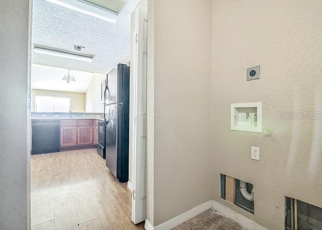 2503 SE 18th Cir, Ocala, FL 34471 - laundry area featuring visible vents, laundry area, light wood finished floors, electric dryer hookup, and hookup for a washing machine