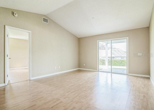 2503 SE 18th Cir, Ocala, FL 34471 - unfurnished room with visible vents, baseboards, light wood-type flooring, and vaulted ceiling