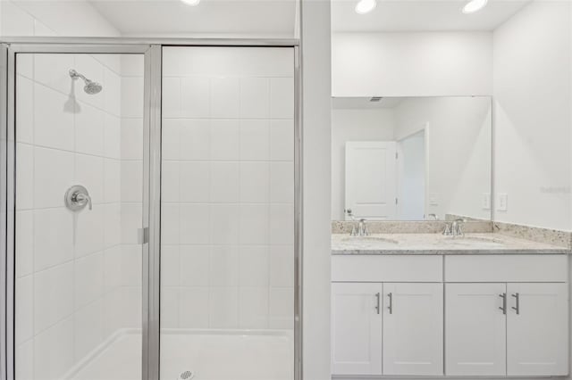 1861 Brekey Way, Zephyrhills, FL 33541 - bathroom featuring a stall shower, recessed lighting, and double vanity