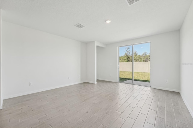 1861 Brekey Way, Zephyrhills, FL 33541 - unfurnished room featuring light wood-type flooring and baseboards