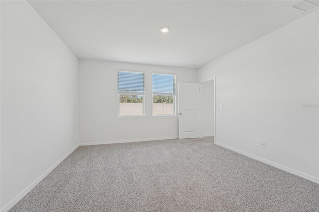 1861 Brekey Way, Zephyrhills, FL 33541 - unfurnished room featuring light colored carpet, baseboards, and recessed lighting