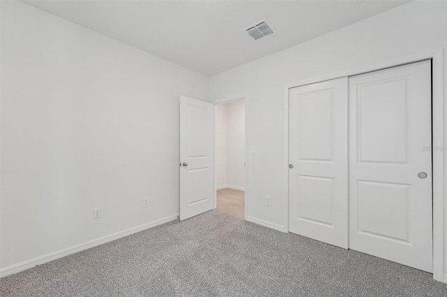 1861 Brekey Way, Zephyrhills, FL 33541 - unfurnished bedroom featuring carpet, baseboards, and a closet