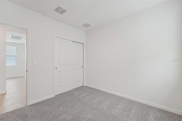 1861 Brekey Way, Zephyrhills, FL 33541 - unfurnished bedroom with baseboards, carpet flooring, and a closet