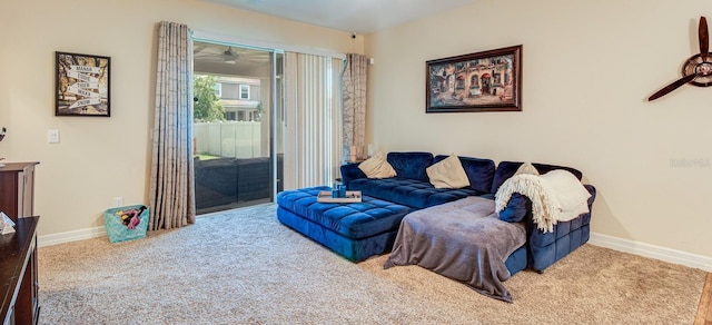 2331 Kennington Cv, Deland, FL 32724 - carpeted living area with baseboards and ceiling fan
