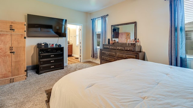 2331 Kennington Cv, Deland, FL 32724 - carpeted bedroom with ensuite bathroom and baseboards