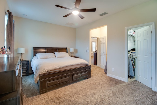 2331 Kennington Cv, Deland, FL 32724 - bedroom with a ceiling fan, a spacious closet, light colored carpet, baseboards, and visible vents