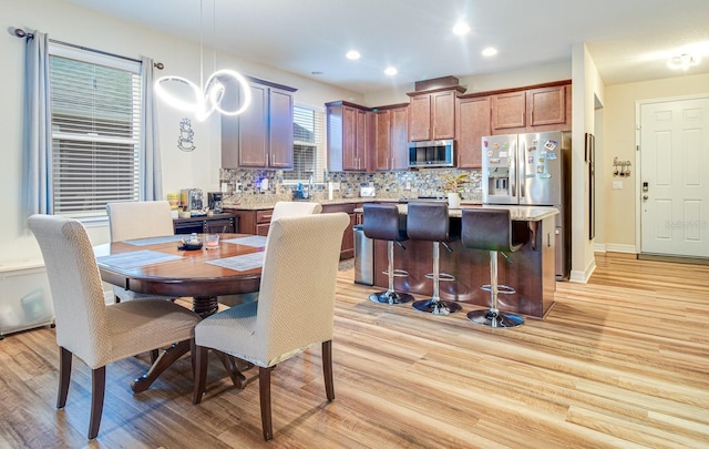 2331 Kennington Cv, Deland, FL 32724 - dining space featuring light wood-style floors and recessed lighting