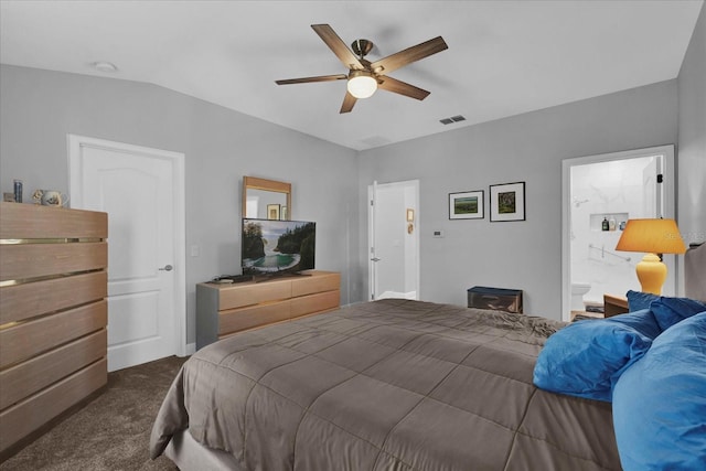 bedroom with a ceiling fan, dark carpet, connected bathroom, and visible vents