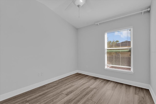 unfurnished room featuring a ceiling fan, baseboards, and wood finished floors
