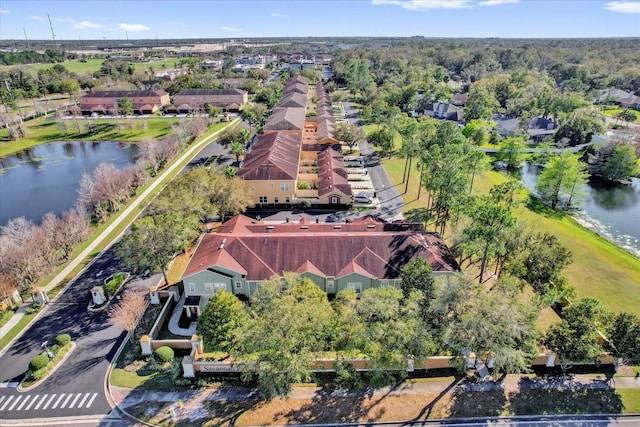 birds eye view of property featuring a water view and a residential view
