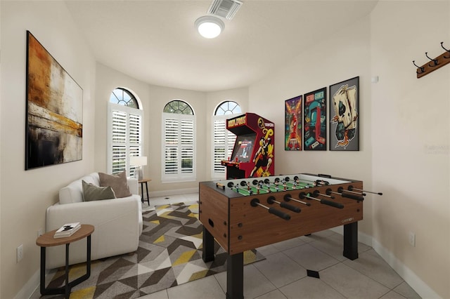 rec room with baseboards and visible vents