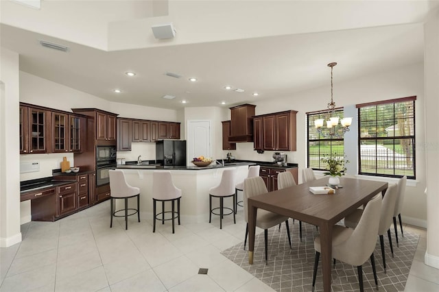 dining space featuring visible vents, recessed lighting, a chandelier, light tile patterned floors, and baseboards