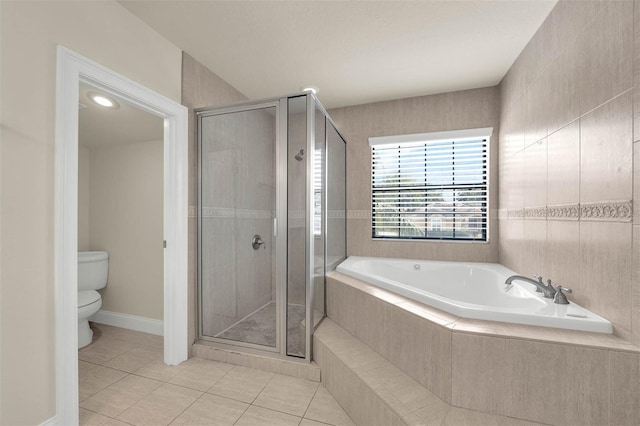 full bath featuring tile patterned floors, toilet, a stall shower, and a bath