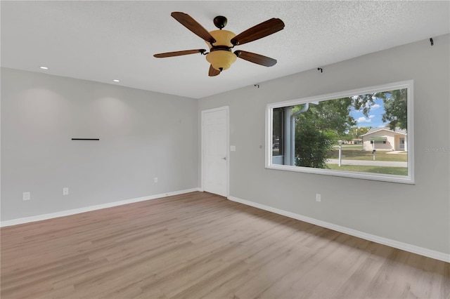 6366 SW 115th Street Rd, Ocala, FL 34476 - empty room featuring light wood-type flooring, baseboards, and a ceiling fan