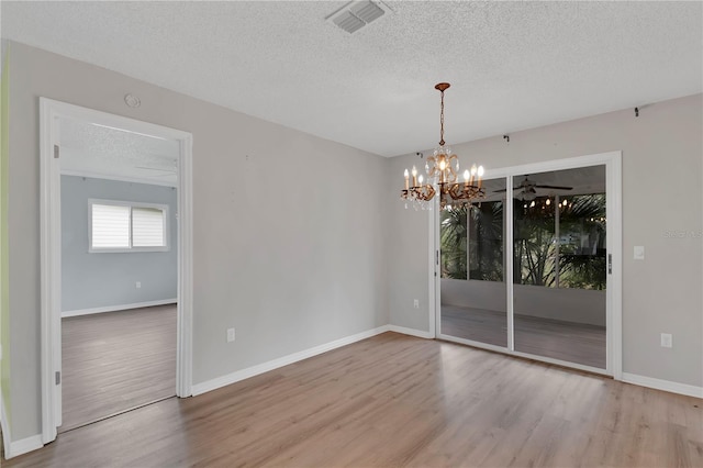 6366 SW 115th Street Rd, Ocala, FL 34476 - spare room featuring a textured ceiling, wood finished floors, and visible vents