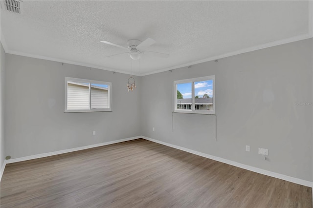 6366 SW 115th Street Rd, Ocala, FL 34476 - empty room featuring visible vents, a textured ceiling, a ceiling fan, and wood finished floors