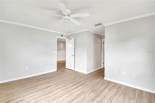 6366 SW 115th Street Rd, Ocala, FL 34476 - empty room featuring visible vents, baseboards, ornamental molding, light wood-type flooring, and ceiling fan with notable chandelier