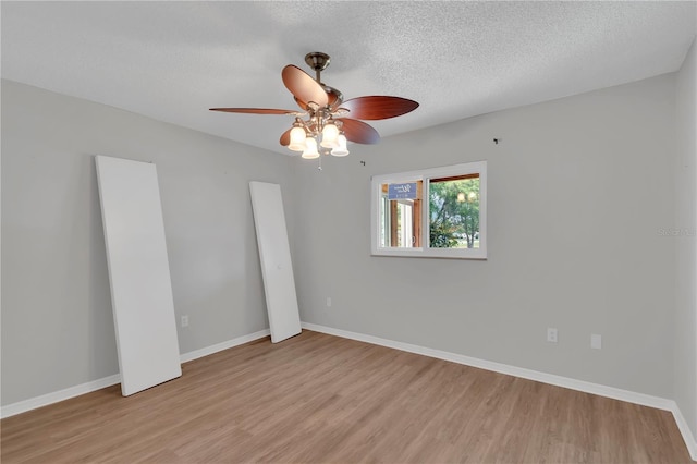 6366 SW 115th Street Rd, Ocala, FL 34476 - unfurnished room with light wood-style flooring, a textured ceiling, baseboards, and ceiling fan