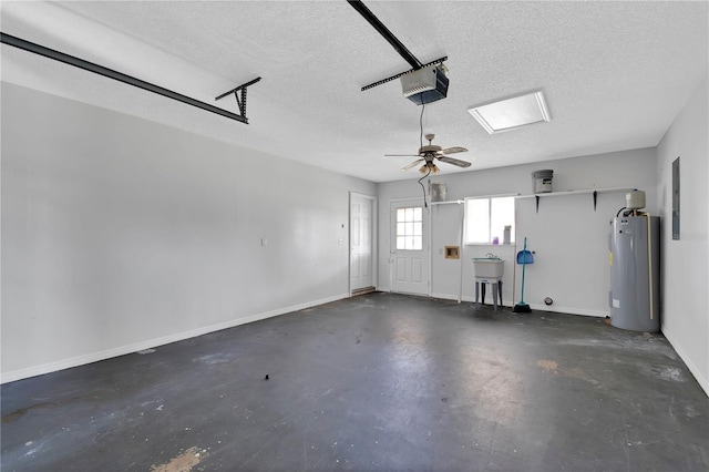 6366 SW 115th Street Rd, Ocala, FL 34476 - garage featuring ceiling fan, water heater, a sink, a garage door opener, and baseboards