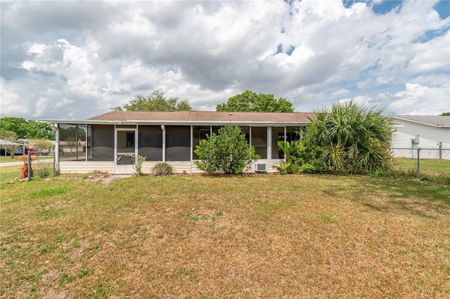 6366 SW 115th Street Rd, Ocala, FL 34476 - back of property featuring a sunroom, fence, and a lawn