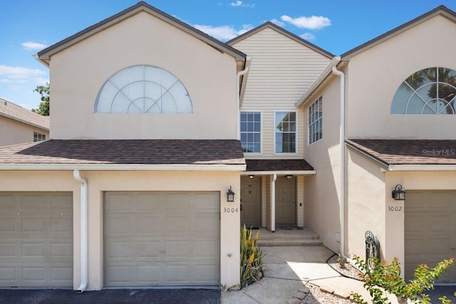3004 Cottage Grove Ct Unit 1805, Orlando, FL 32822 - view of property with stucco siding and an attached garage
