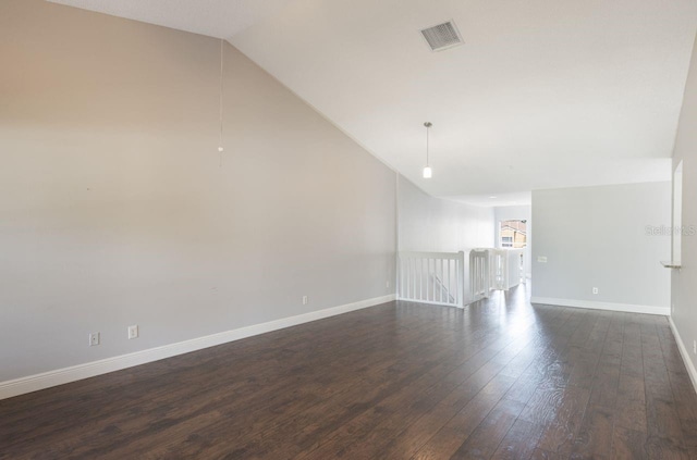 3004 Cottage Grove Ct Unit 1805, Orlando, FL 32822 - spare room featuring vaulted ceiling and dark wood finished floors