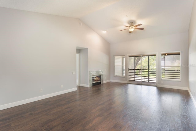 3004 Cottage Grove Ct Unit 1805, Orlando, FL 32822 - unfurnished living room featuring ceiling fan, a glass covered fireplace, dark wood finished floors, and high vaulted ceiling
