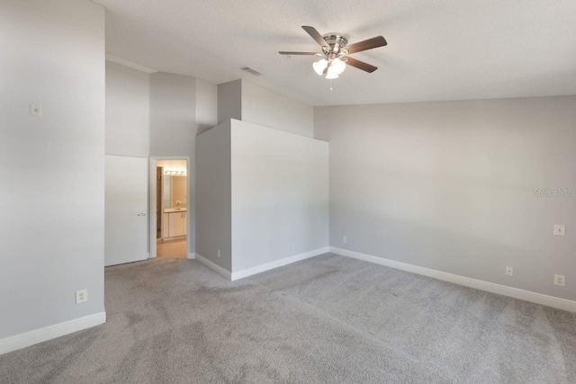 3004 Cottage Grove Ct Unit 1805, Orlando, FL 32822 - empty room featuring ceiling fan, carpet, and vaulted ceiling