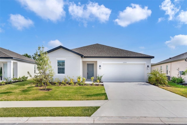 10008 Last Light Gln, Parrish, FL 34219 - single story home with stucco siding, an attached garage, driveway, and a front lawn