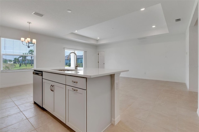 10008 Last Light Gln, Parrish, FL 34219 - kitchen featuring an inviting chandelier, a sink, a raised ceiling, and dishwasher