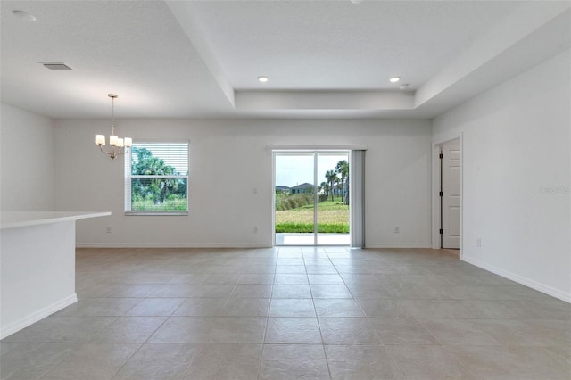 10008 Last Light Gln, Parrish, FL 34219 - empty room with a chandelier, plenty of natural light, light tile patterned floors, and visible vents