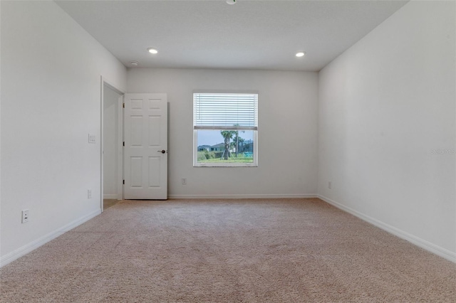 10008 Last Light Gln, Parrish, FL 34219 - spare room featuring recessed lighting, baseboards, and light carpet