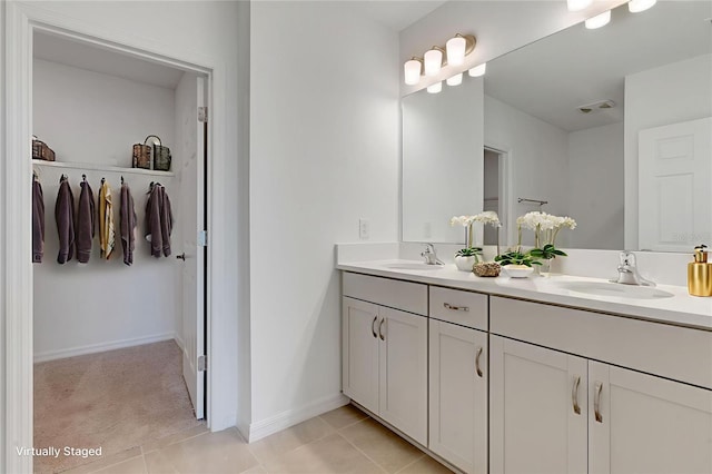 10008 Last Light Gln, Parrish, FL 34219 - full bath featuring double vanity, a spacious closet, and tile patterned flooring
