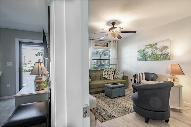 865 Ladyfish Ave Unit C104, New Smyrna Beach, FL 32169 - living room featuring baseboards, a ceiling fan, and wood finished floors