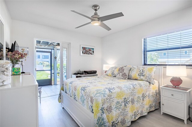 865 Ladyfish Ave Unit C104, New Smyrna Beach, FL 32169 - bedroom with access to outside, light wood-style floors, and multiple windows
