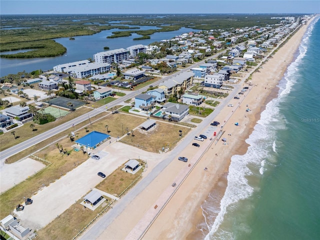865 Ladyfish Ave Unit C104, New Smyrna Beach, FL 32169 - drone / aerial view featuring a beach view and a water view