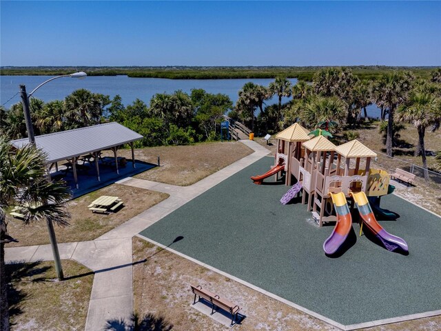 865 Ladyfish Ave Unit C104, New Smyrna Beach, FL 32169 - view of home's community featuring a water view and a playground