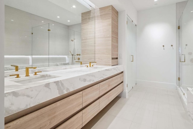 full bath featuring recessed lighting, a sink, double vanity, and a stall shower