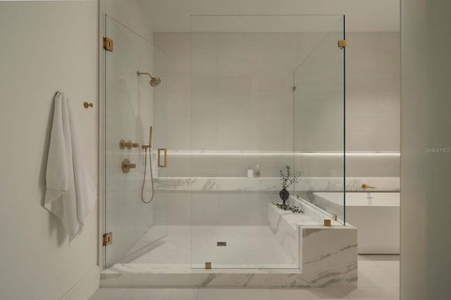 full bath featuring a bath and a stall shower