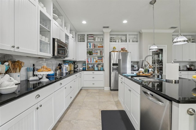 11725 Verrazano Dr, Orlando, FL 32836 - kitchen featuring stainless steel appliances, a sink, open shelves, crown molding, and backsplash