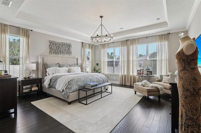 11725 Verrazano Dr, Orlando, FL 32836 - bedroom with a raised ceiling, a chandelier, crown molding, dark wood-style floors, and a textured ceiling