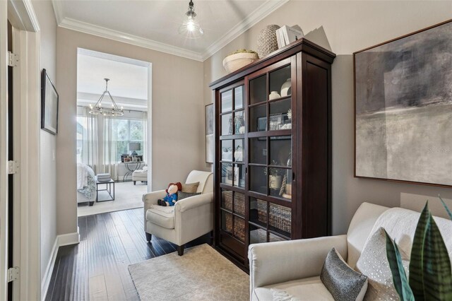 11725 Verrazano Dr, Orlando, FL 32836 - sitting room featuring hardwood / wood-style flooring, crown molding, a chandelier, and baseboards