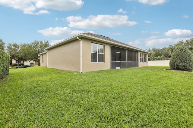 11725 Verrazano Dr, Orlando, FL 32836 - rear view of house featuring stucco siding and a sunroom