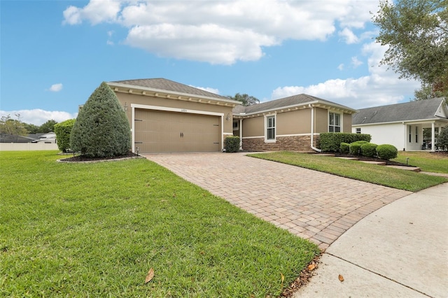 11725 Verrazano Dr, Orlando, FL 32836 - view of front of house featuring decorative driveway, stucco siding, a garage, and a front yard
