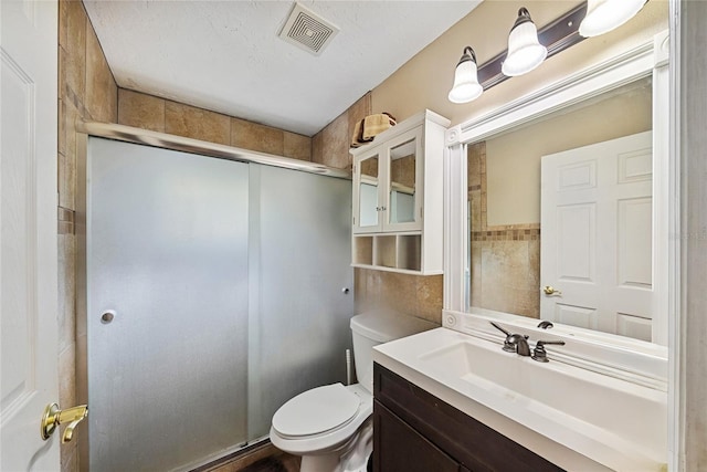 3512 W Whippoorwill St, Lecanto, FL 34461 - bathroom featuring vanity, a stall shower, and tile walls